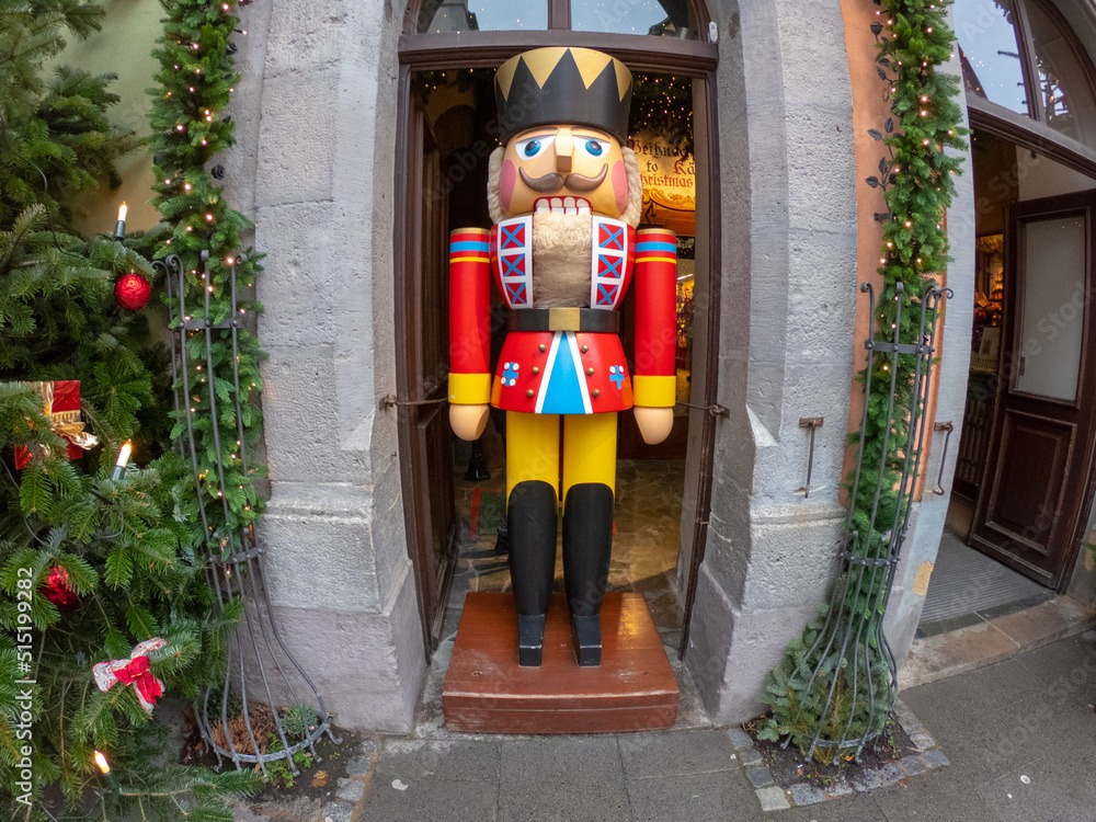Rothenburg ob der Tauber, Germany, December 8, 2021: A wooden nutcracker doll outside a shop. A toy soldier represents good luck in the German tradition. It is used as a Christmas decoration.